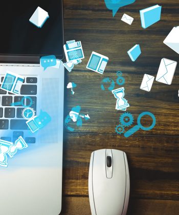 digital composite of mouse and laptop with communication graphics